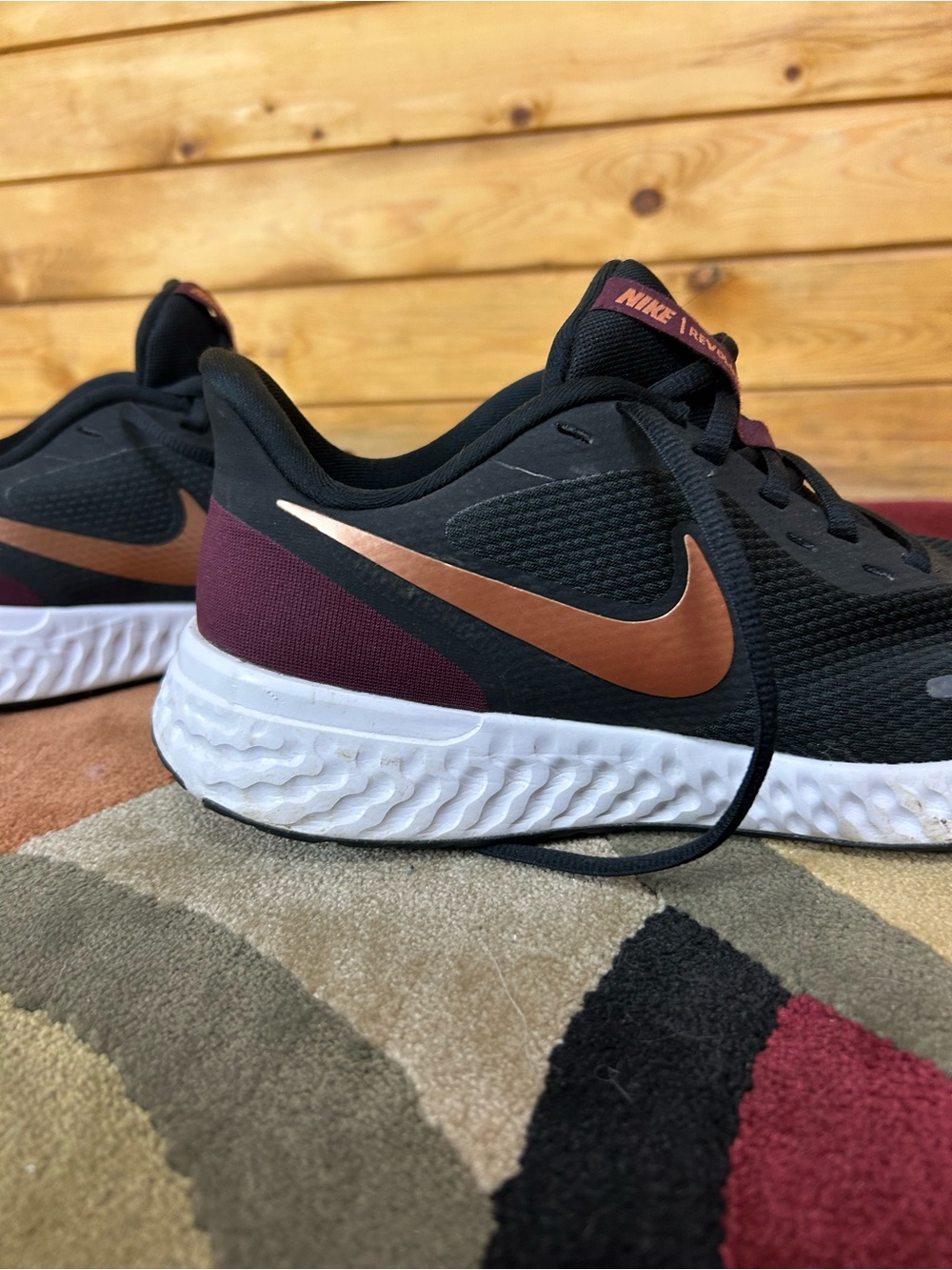 Nike Black Running Shoes with Copper Swoosh and Burgundy Heel